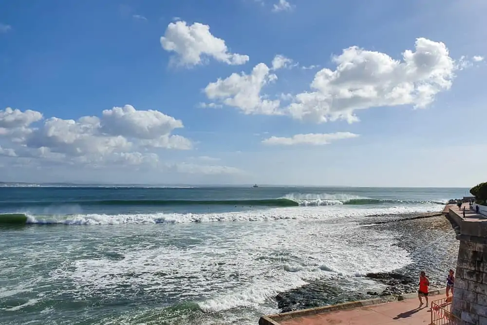 Surfers in the lineup at the amazing righthander of Praia da Santo Amaro