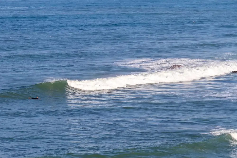 Lonely surfer trying to catch the right at São Sebastião