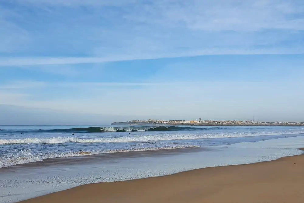 Surfer gets barreled at supertubos beach in Peniche